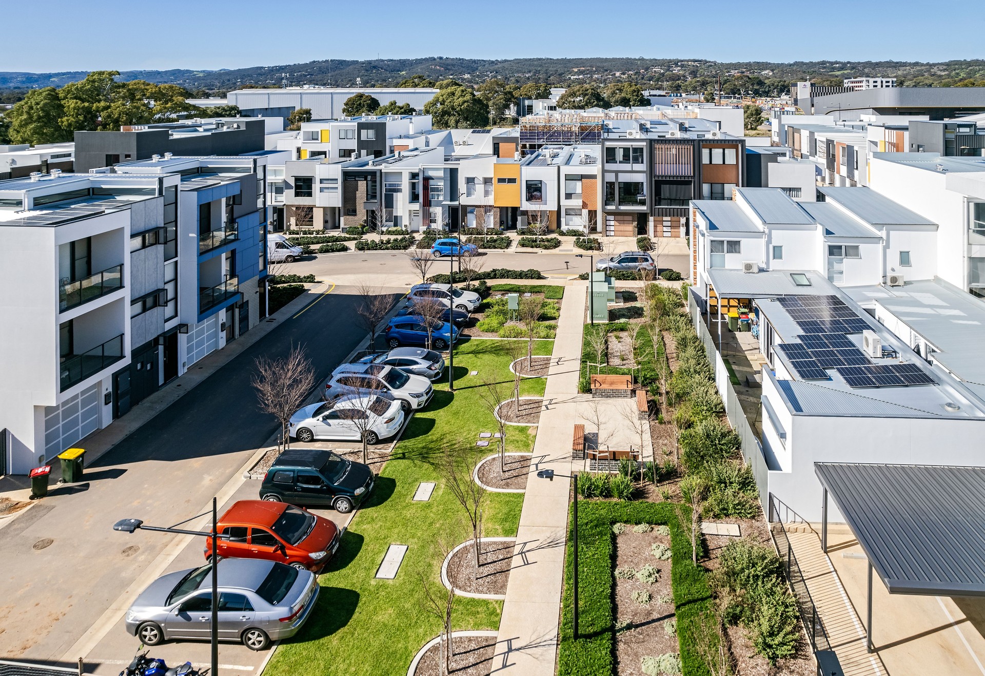 Home ownership, sustainability issues: low aerial view urban redevelopment with medium density affordable housing